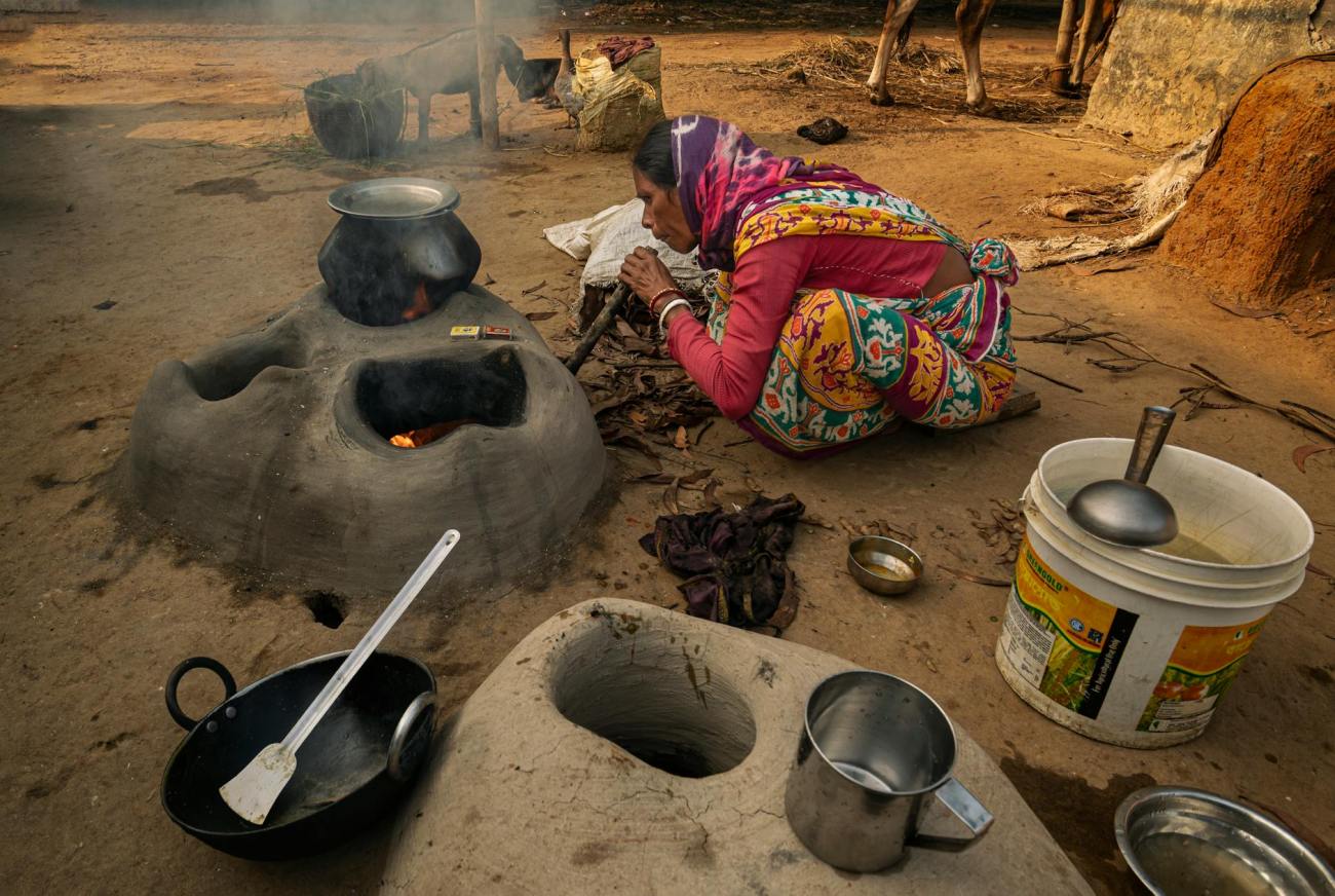 woman cooking in traditional way